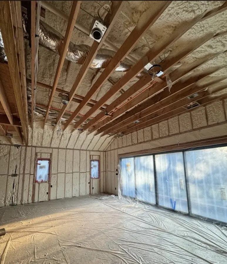 Interior walls and ceiling insulated with spray foam during new construction in Lake Geneva
